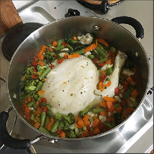 Chicken stew fully cooked, before deboning.